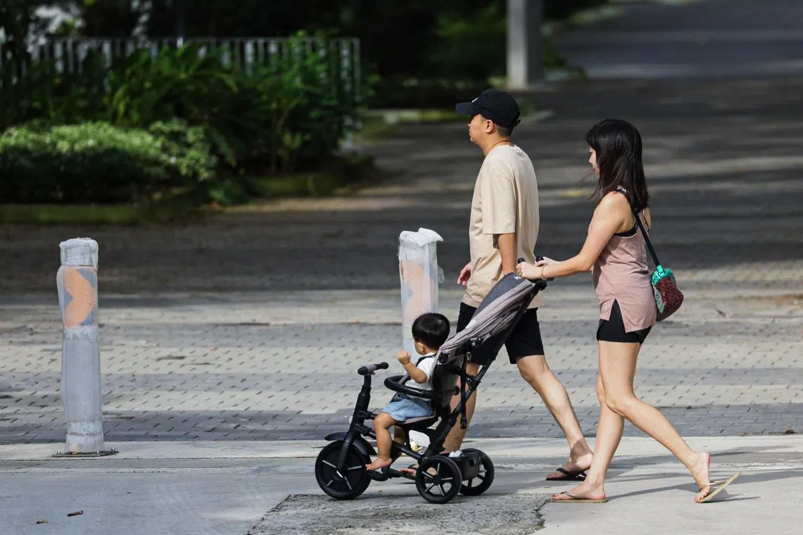 Addressing Singapore’s existential challenge of falling birth rates may require rethinking how society shares the cost of raising children, says the writer. 