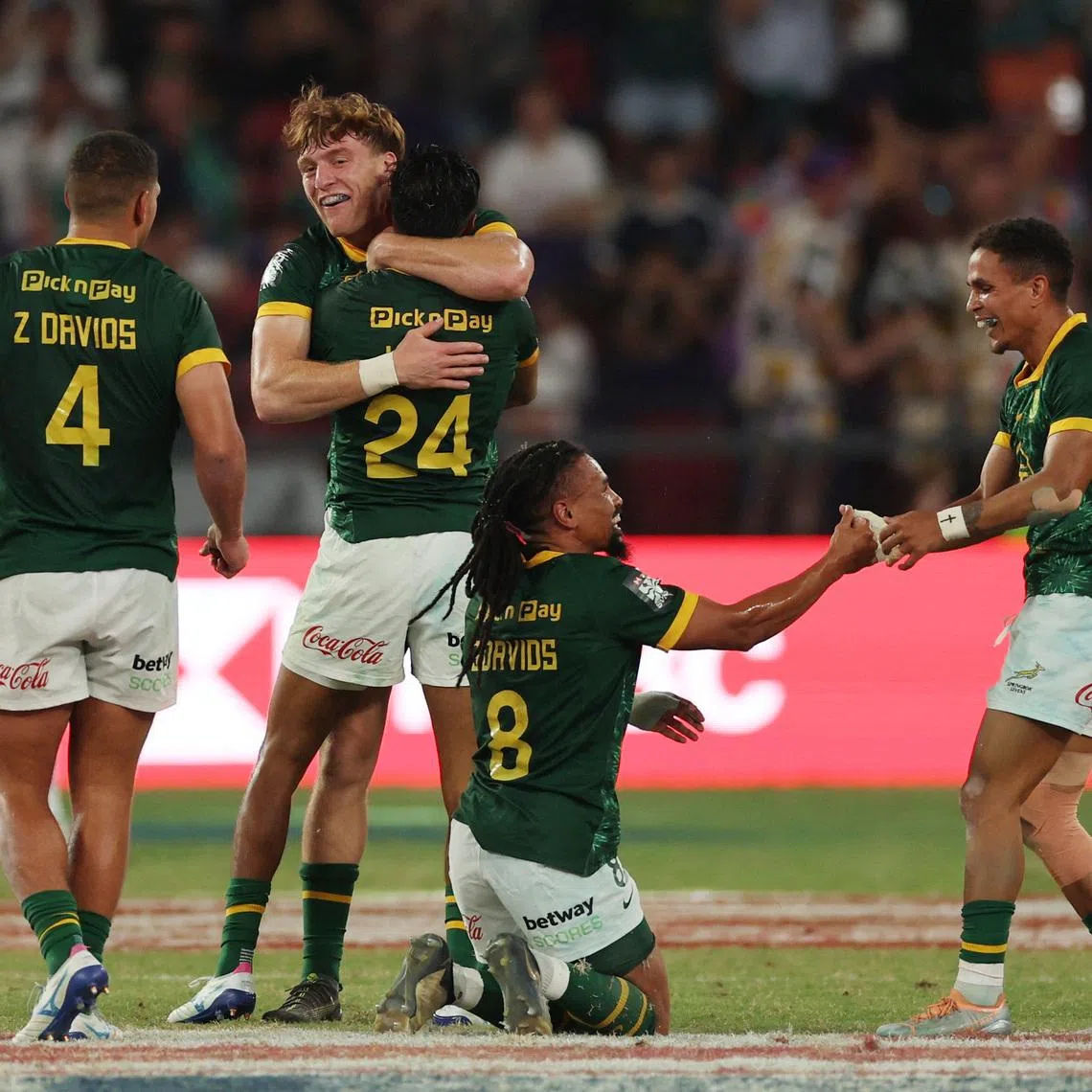 FILE PHOTO: Rugby Union - HSBC Sevens World Championships - Men's Cup Final - South Africa v Argentina - Hong Kong - Kai Tak Sports Park, Hong Kong, China - April 19, 2026 South Africa players celebrate after winning the Men's Cup Final REUTERS/Tyrone Siu/File Photo