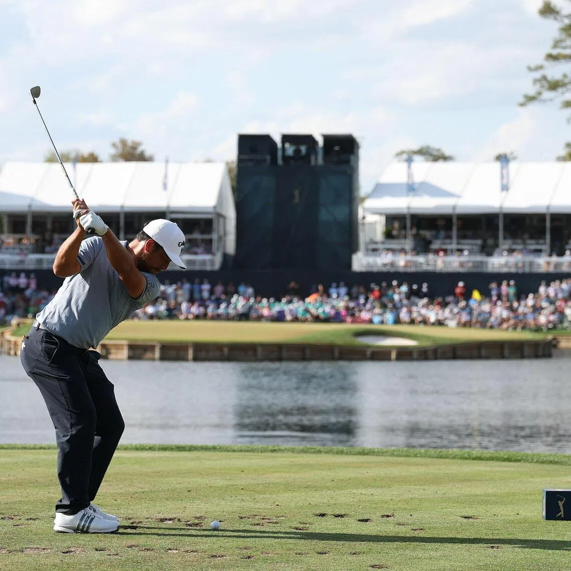Xander Schauffele of the United States plays his shot from the 17th tee during the final round of The Players Championship.