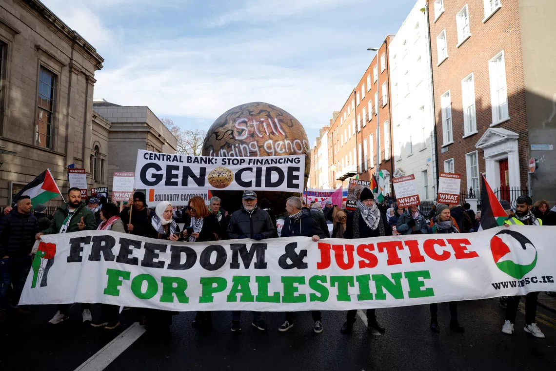 FILE PHOTO: Actor Liam Cunningham leads demonstrators as they hold a banner in support of Palestinians during a march on the International Day of Solidarity, in Dublin, Ireland, November 29, 2025. REUTERS/Clodagh Kilcoyne/File Photo