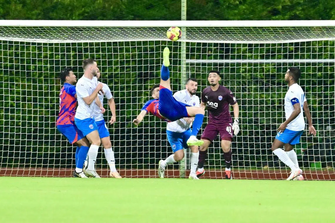 The Lion City Sailors players watch on as Romeo Morales scores a bicycle kick to give Johor Darul Takzim a two-goal lead.