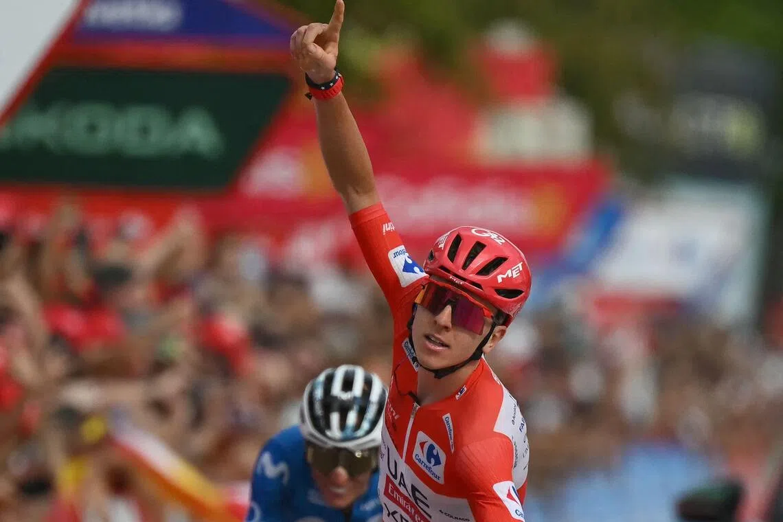 Team UAE’s Tadej Pogacar celebrates his Stage 6 win, with Team Movistar’s Enric Mas on his tail.