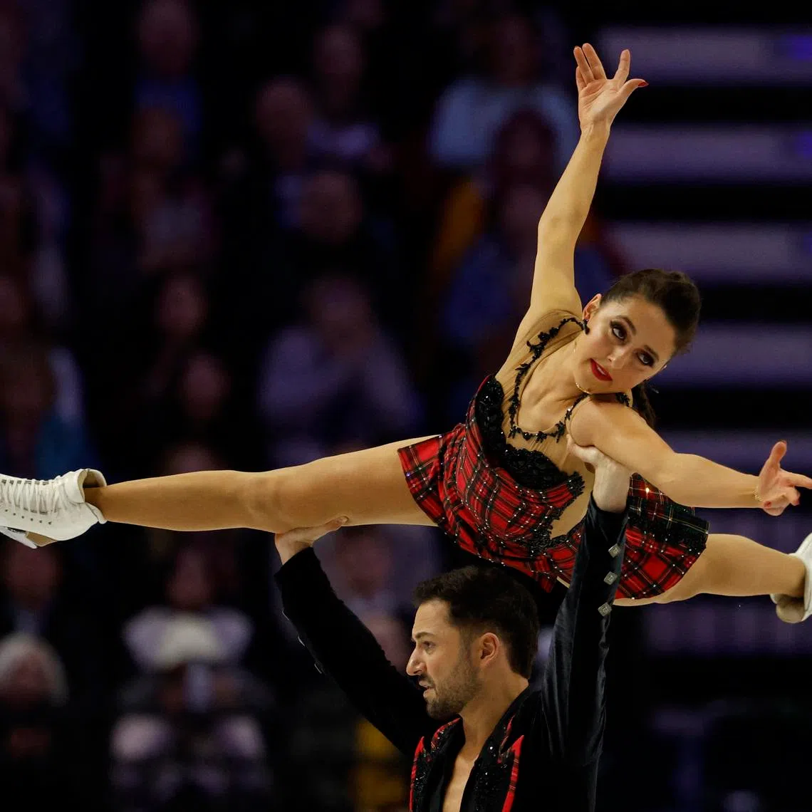 Figure Skating - ISU Figure Skating World Championships - O2 arena, Prague, Czech Republic - March 28, 2026 Britain's Lilah Fear and Lewis Gibson perform during the Ice Dance Free Dance REUTERS/David W Cerny