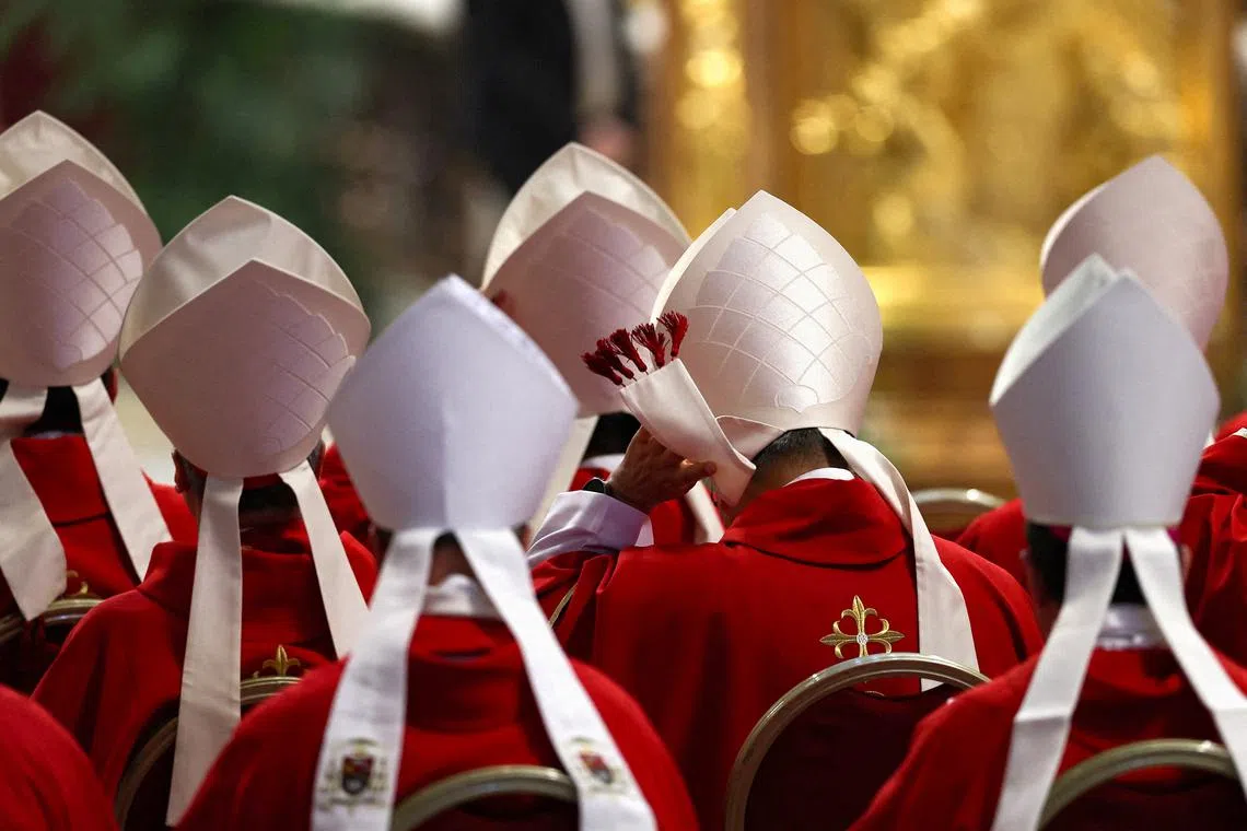 FILE PHOTO: Cardinals attend a mourning Mass for Pope Francis on the sixth day of Novendiali (nine days of mourning after the Pope's funeral) at St. Peter's Basilica at the Vatican, May 1, 2025. REUTERS/Amanda Perobelli/File Photo