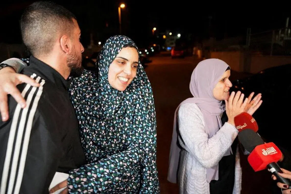 Released Palestinian prisoner Marah Bkeer reacts with a family near her house after hostages-prisoners swap deal between Hamas and Israel, in Jerusalem November 24, 2023. REUTERS/Latifeh Abdellatif