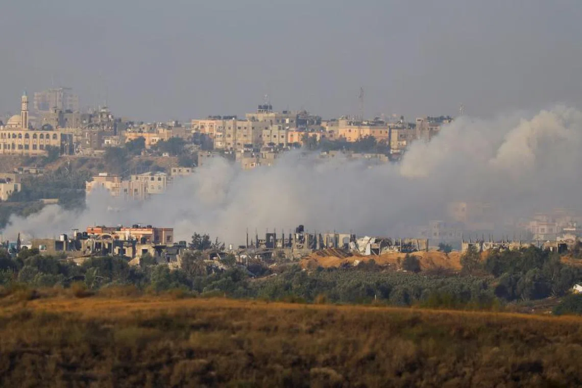 Smoke rises after Israeli strikes in Gaza, as seen from southern Israel, amid the ongoing conflict between Israel and the Palestinian group Hamas, November 21, 2023. REUTERS/Alexander Ermochenko