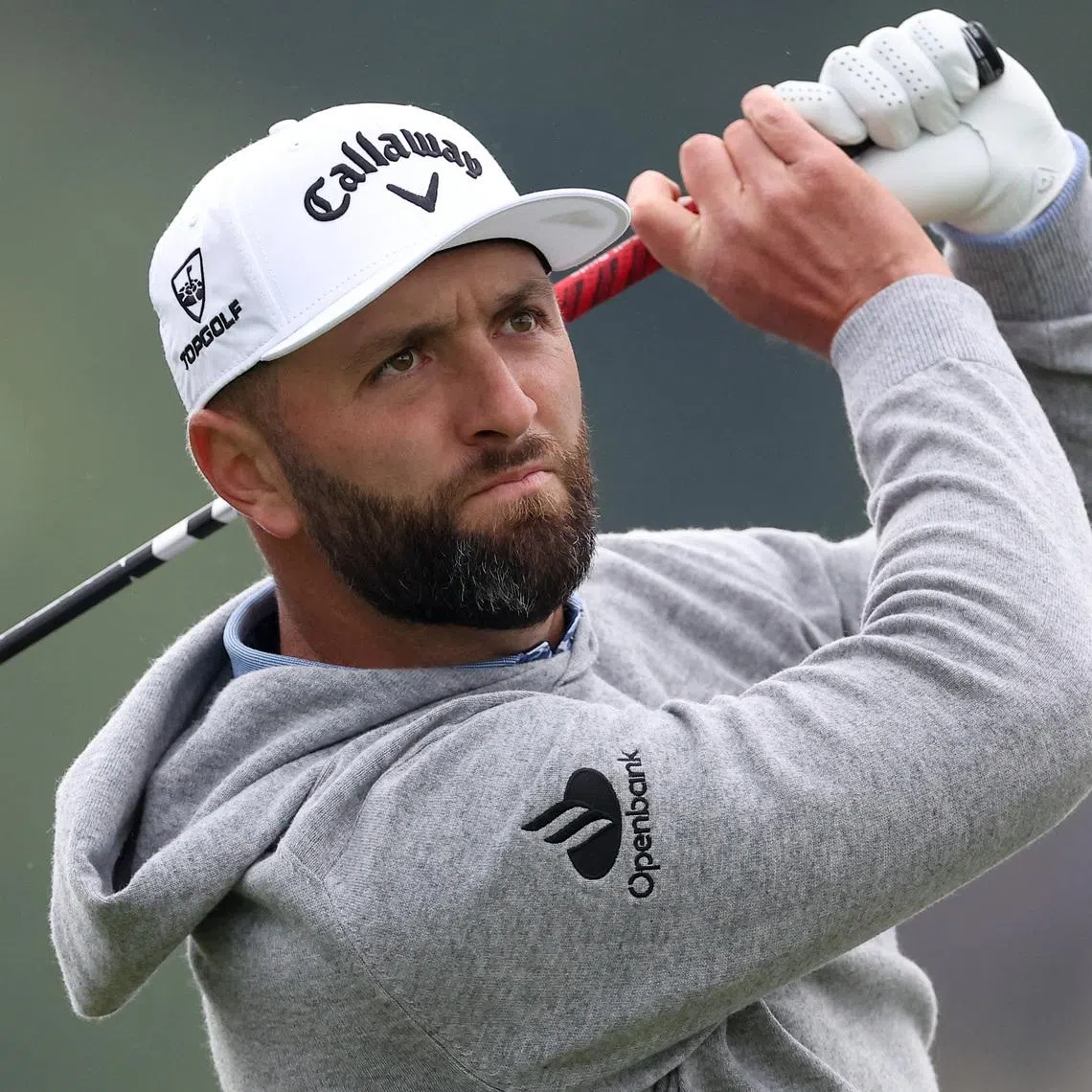 May 14, 2026; Newtown Square, Pennsylvania, USA; Jon Rahm plays his shot from the 11th tee during the first round of the PGA Championship golf tournament at Aronimink Golf Club. Mandatory Credit: Bill Streicher-Imagn Images