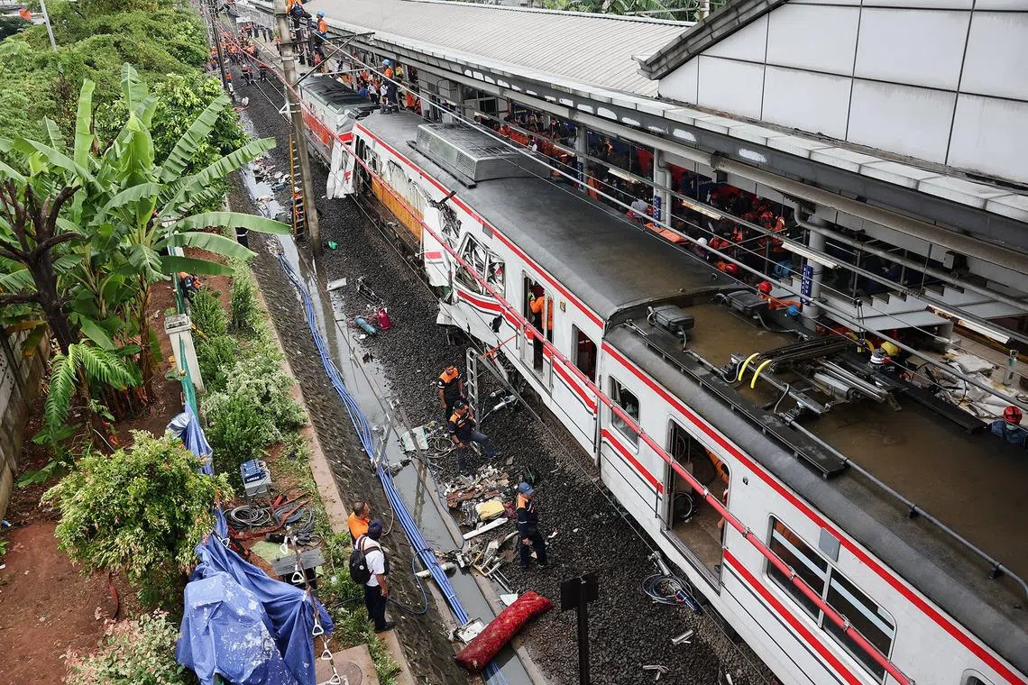 The death toll from a train collision near the Indonesian capital Jakarta has risen to 14 with another 84 injured.
