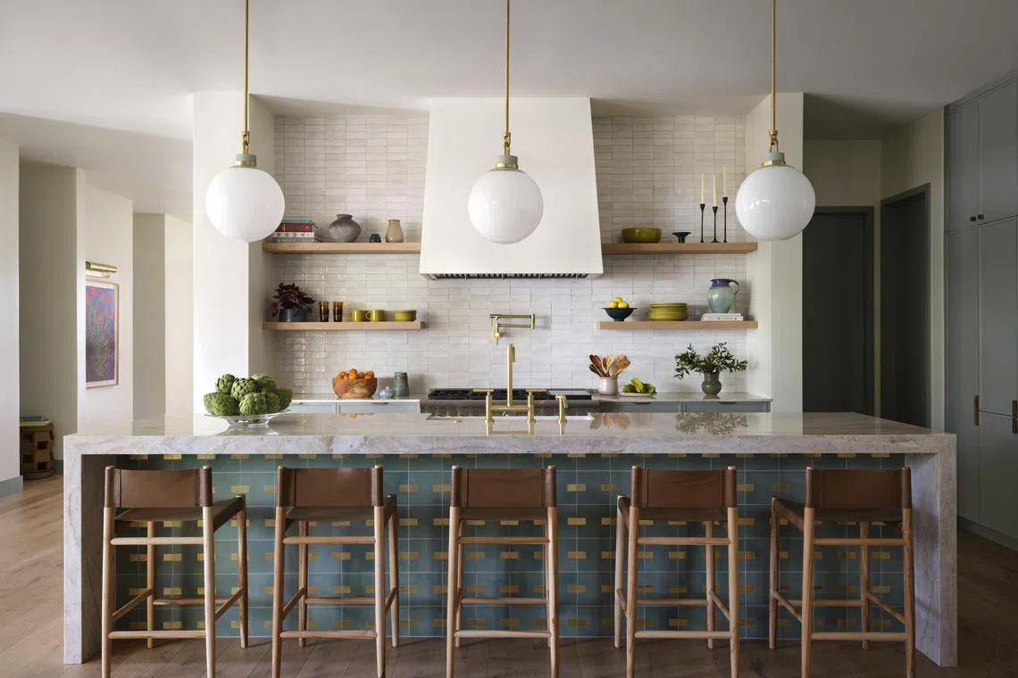 In an undated photo from Lindsay Brown, a kitchen by Annie Downing with a zellige tile backsplash above the range and cement tile with brass inlays beneath the island. A great backsplash can help a kitchen look its best. (Lindsay Brown via The New York Times) — NO SALES; FOR EDITORIAL USE ONLY WITH NYT STORY KITCHEN BACKSPLASH BY TIM MCKEOUGH FOR DEC. 31, 2024. ALL OTHER USE PROHIBITED. —