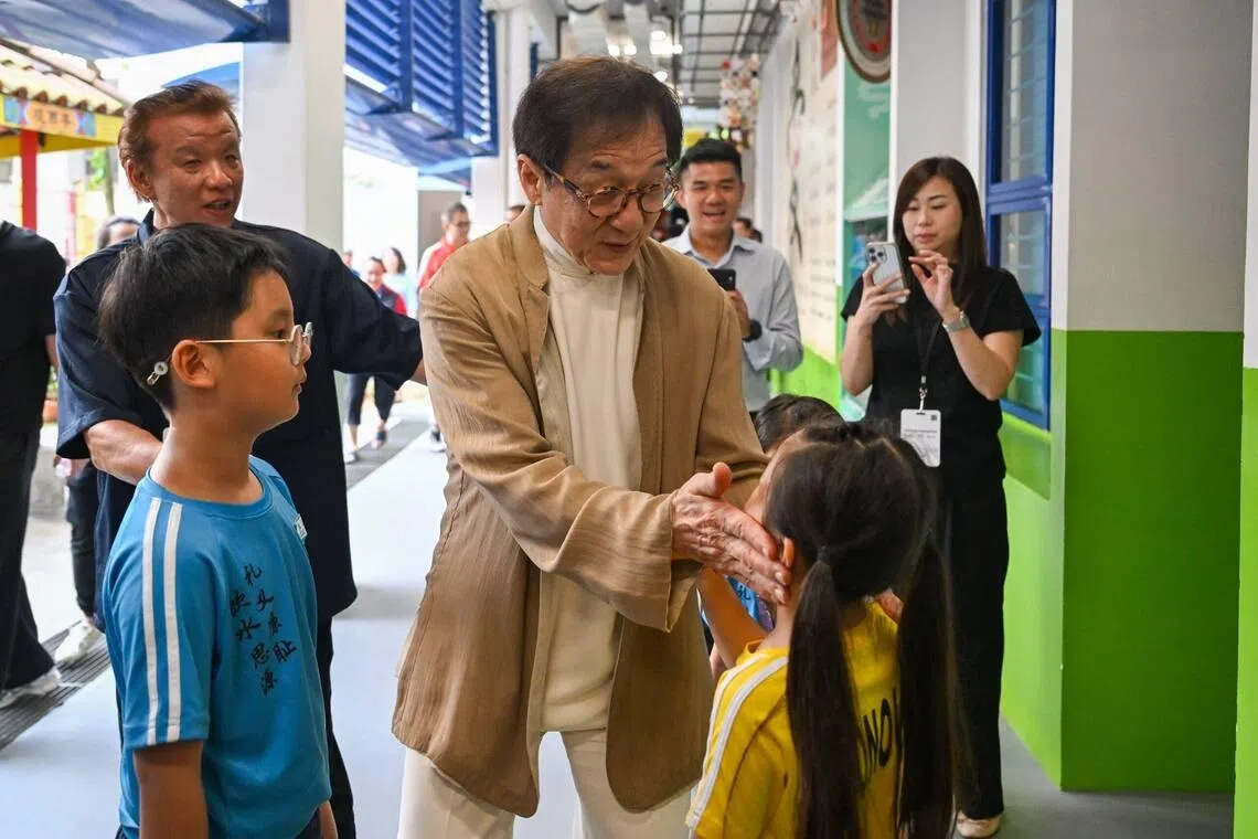 Image 3: Jackie Chan interacting with students at Pei Chun Public School in Toa Payoh on .