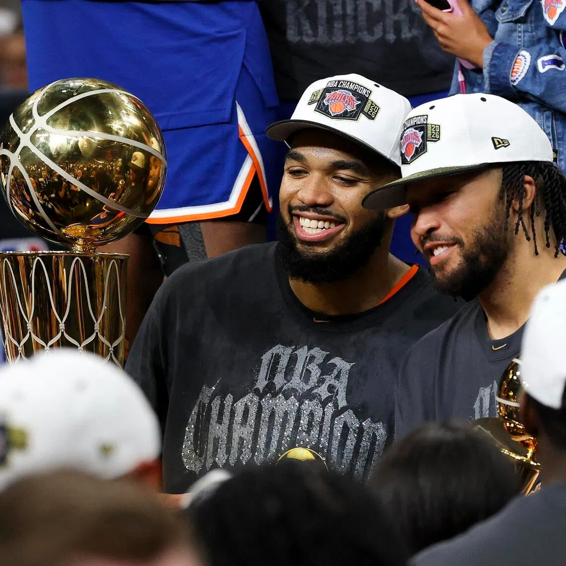 New York Knicks centre Karl-Anthony Towns (left) and guard Jalen Brunson celebrates with team-mates after the Knicks defeat the San Antonio Spurs.