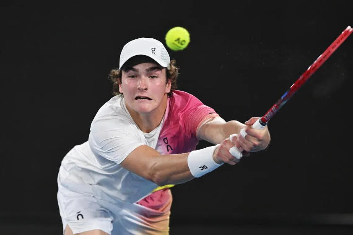 epa11823826 Joao Fonseca of Brazil in action during the Men's Singles first round match against Andrey Rublev of Russia at the Australian Open Grand Slam tennis tournament in Melbourne, Australia, 14 January 2025. EPA-EFE/LUKAS COCH AUSTRALIA AND NEW ZEALAND OUT