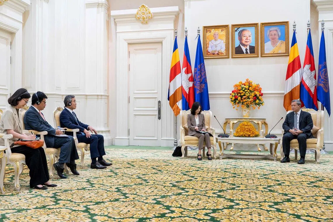 Cambodia's Prime Minister Hun Manet (right) speaks to South Korea's Second Vice-Foreign Minister Kim Jina during a meeting at the Peace Palace in Phnom Penh. 