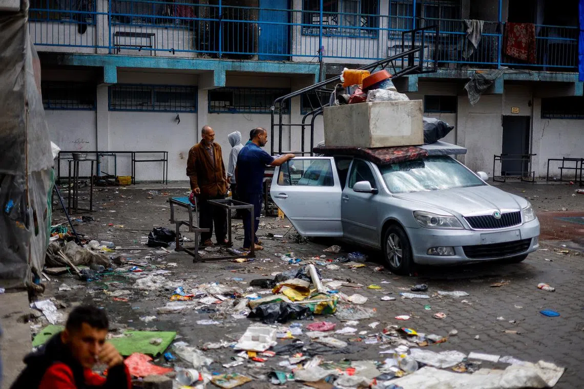 Displaced Palestinians sheltering in a school prepare to flee Rafah after Israeli forces launched a ground and air operation in the eastern part of the southern Gaza City, amid the ongoing conflict between Israel and Hamas, in Rafah, in the southern Gaza Strip May 13, 2024. REUTERS/Mohammed Salem