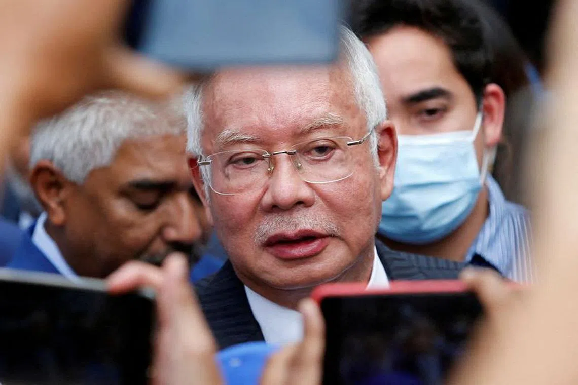 FILE PHOTO: Former Malaysian Prime Minister Najib Razak speaks to journalists outside the Federal Court during a court break, in Putrajaya, Malaysia August 23, 2022. REUTERS/Lai Seng Sin/File Photo