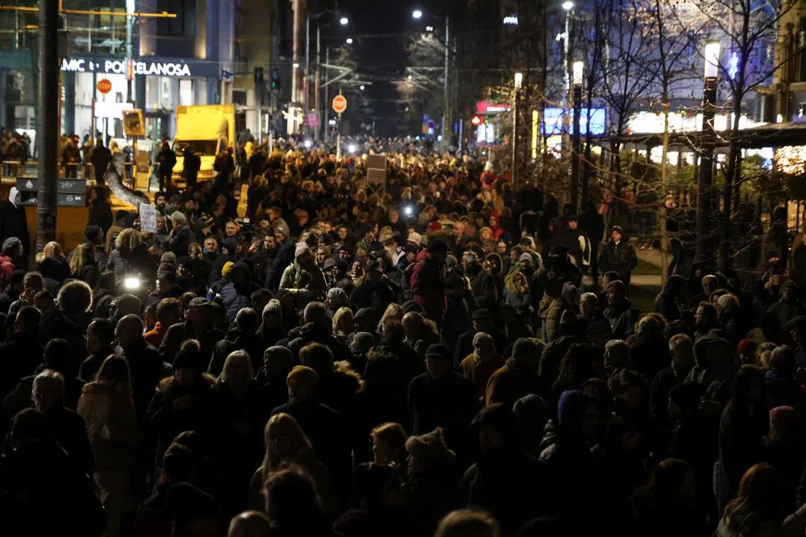 Supporters of the opposition 'Serbia Against Violence' (SPN) coalition gather in front of St. Marko church to light up candles on the anniversary of the murder of Oliver Ivanovic, Kosovo Serb moderate politician, after the SPN alleged major election law violations in the Belgrade city and parliament races, in Belgrade, Serbia January 16, 2024. REUTERS/Zorana Jevtic