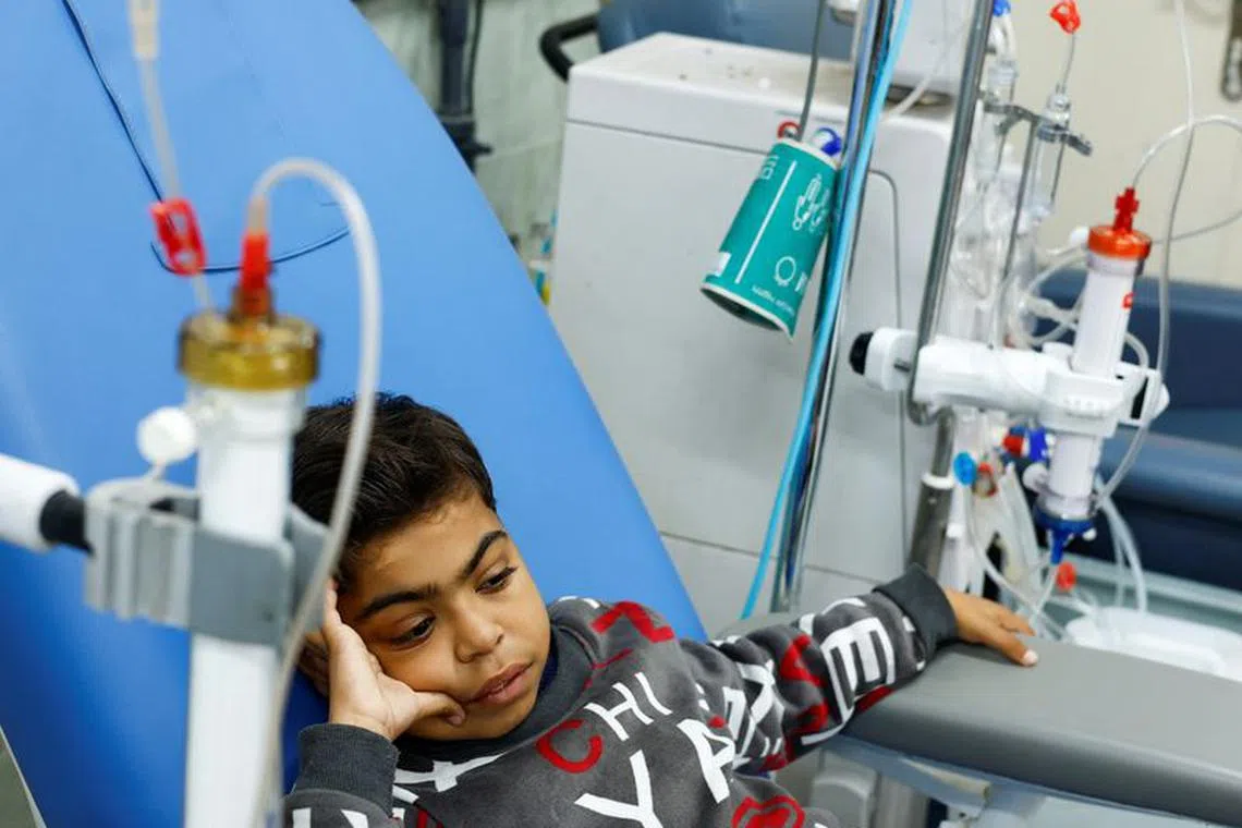 Palestinian boy Naseem Mohra, a 10-year-old kidney patient from northern Gaza who fled south with his family when Israel began the ground assault against Hamas and was separated from his mother, undergoes kidney dialysis at a hospital in Rafah in the southern Gaza Strip December 24, 2023. REUTERS/Mohammed Salem