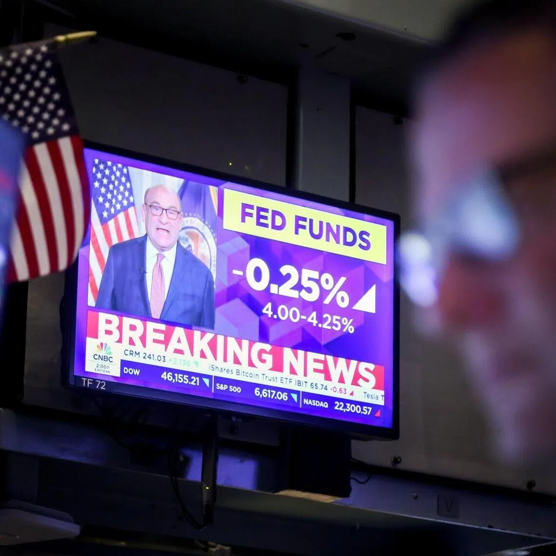 A television at the New York Stock Exchange broadcasting the Federal Reserve's decision to cut rates, on Sept 17.