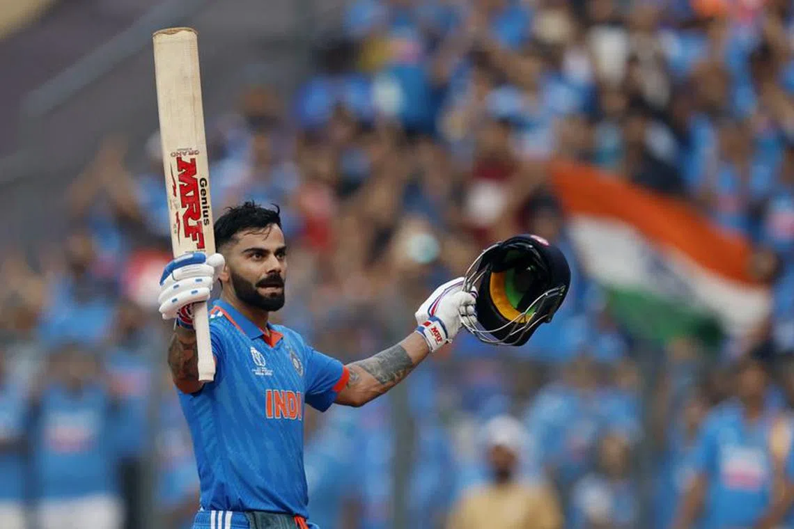 Cricket - ICC Cricket World Cup 2023 - Semi-Final - India v New Zealand - Wankhede Stadium, Mumbai, India - November 15, 2023 India's Virat Kohli acknowledges the crowd and walks back to the pavilion after losing his wicket, caught out by New Zealand's Devon Conway off the bowling of Tim Southee REUTERS/Adnan Abidi