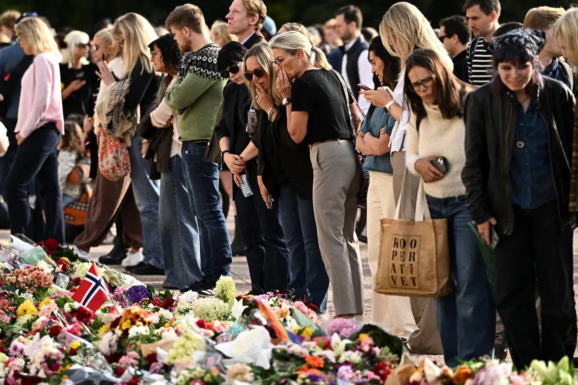 People gather outside the Royal Palace, following the death of Norway’s King Harald, in Oslo, Norway, on Aug 28.
