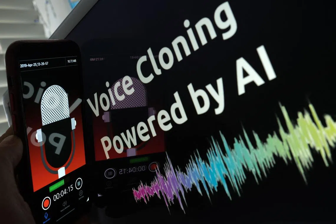 This illustration image created on June 9, 2023 shows a smartphone recording in front of a voice cloning screen in Los Angeles.  (Photo by Chris Delmas / AFP)