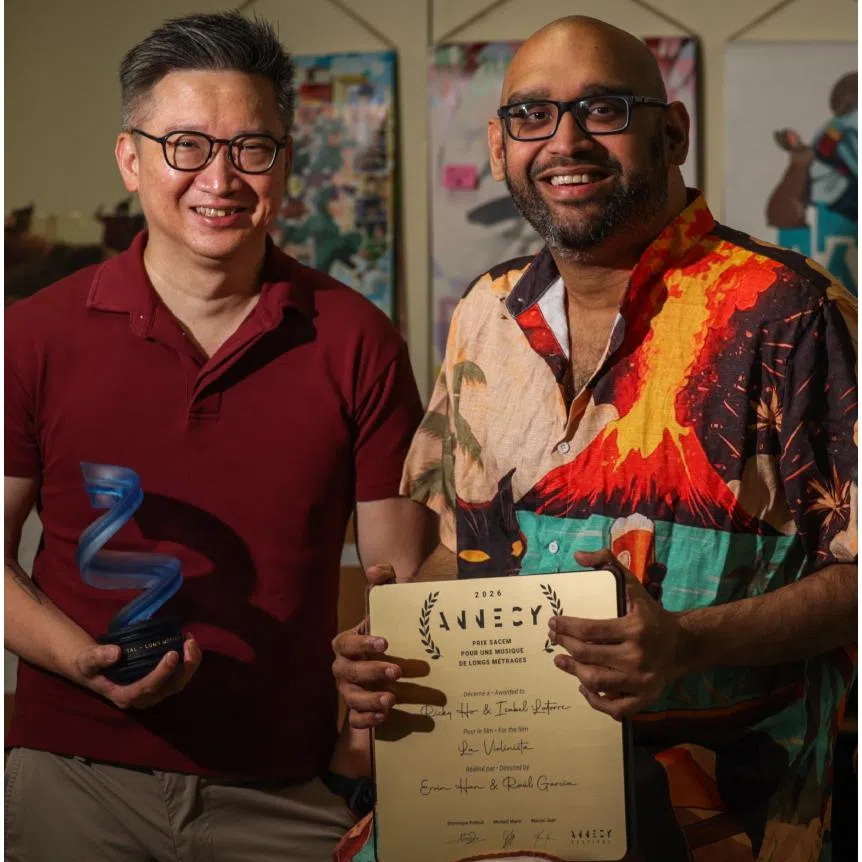 The Violinist’s film-maker Ervin Han (left) and Singaporean producer Justin Deimen with the Cristal trophy, the top prize at the prestigious Annecy International Animation Film Festival; still of the animated film (right).
