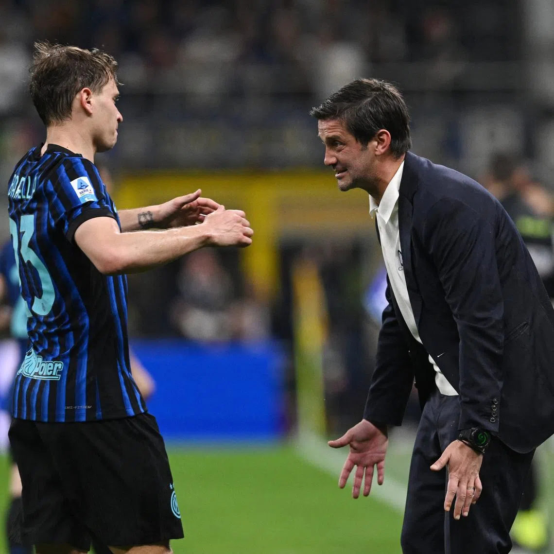 Soccer Football - Serie A - Inter Milan v AS Roma - San Siro, Milan, Italy - April 5, 2026 Inter Milan's Nicolo Barella celebrates scoring their fifth goal with coach Cristian Chivu REUTERS/Jennifer Lorenzini