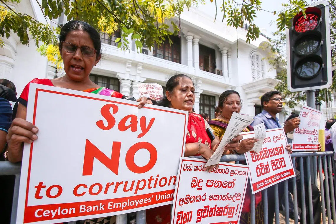 Members of the banks trade union stage a protest to propose tax reforms for country's economic crisis in Colombo on March 14, 2023.
