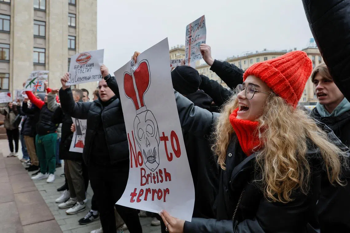 Activists hold a protest against what Russia's officials said is the involvement of British specialists in a Ukrainian drone strike.