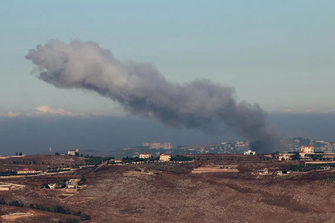 Smoke billows over southern Lebanon, amid ongoing cross-border hostilities between Hezbollah and Israeli forces, as pictured near the border with Israel on Sept 26.