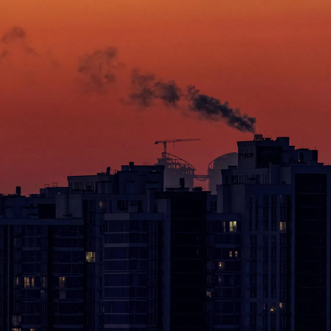 FILE PHOTO: Water vapour rises from residential buildings' autonomous heating systems during a power blackout and freezing temperatures, after critical civil infrastructure was hit by recent Russian missile and drone attacks, amid Russia's attack on Ukraine, in Kyiv, Ukraine January 19, 2026. REUTERS/Vladyslav Sodel/File Photo