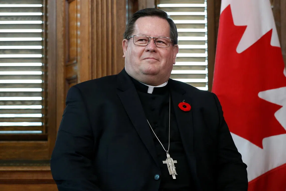 FILE PHOTO: Cardinal Gerald Lacroix, Archbishop of Quebec, takes part in a meeting with Canada's Prime Minister Justin Trudeau in Trudeau's office on Parliament Hill in Ottawa, Ontario, Canada, November 6, 2017. REUTERS/Chris Wattie/File Photo