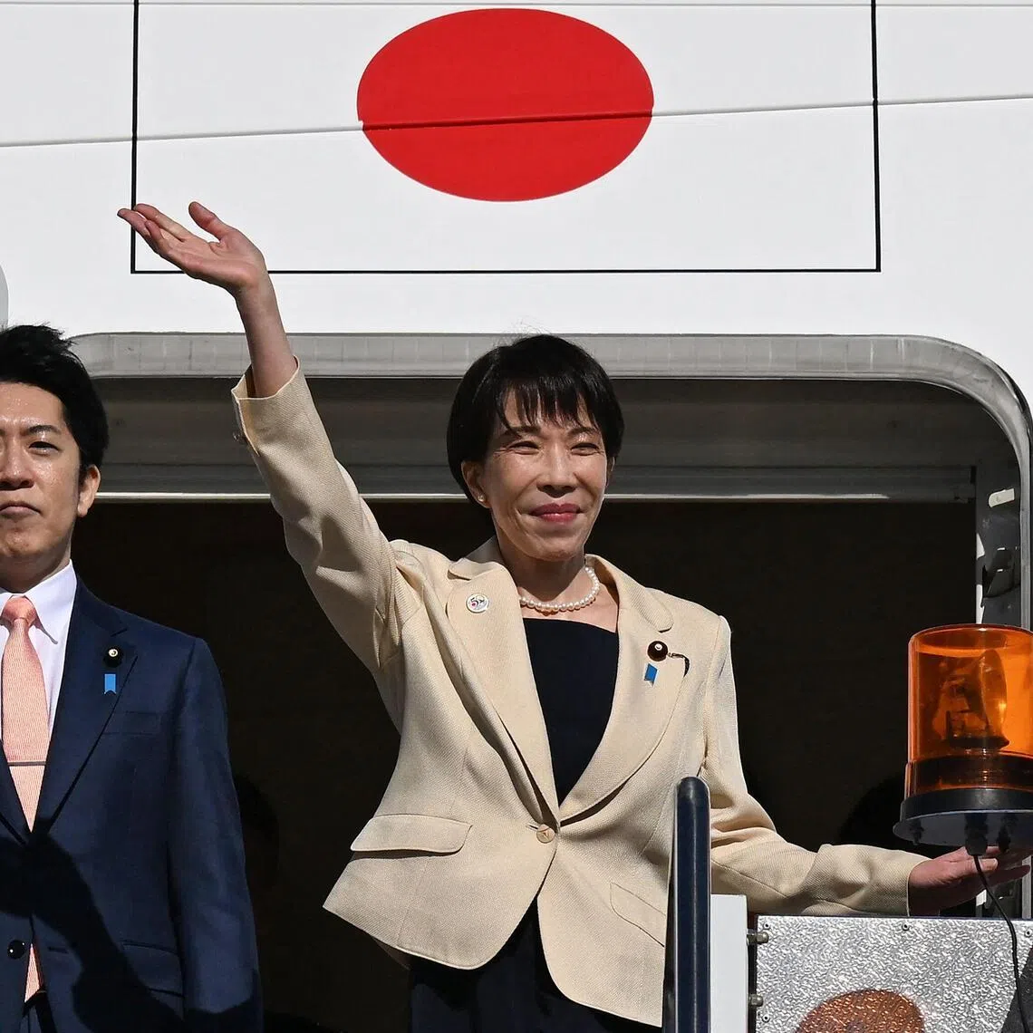 Japan's Prime Minister Sanae Takaichi waves as she departs from a RAAF base in Canberra on May 5. While Ms Takaichi rarely mentioned China by name, she seemed eager to tap into growing anxiety in Asia and Australia over Beijing’s increasingly aggressive military and economic policies. 