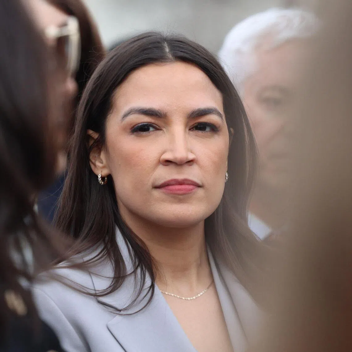 (FILES) US Representative Alexandria Ocasio-Cortez, Democrat from New York (R), looks on in support of the DEFIANCE Act on Capitol Hill in Washington, DC, on January 22, 2026. Alexandria Ocasio-Cortez, one of the most prominent figures on the US left and a potential presidential contender, has revealed she is freezing her eggs, saying she wants to speak openly about choices confronting women balancing careers and family. The 36-year-old Democratic congresswoman from New York shared videos of the fertility treatment on social media over the weekend of August 8-9, 2026, including footage of herself administering hormone injections. (Photo by Alex WROBLEWSKI / AFP)
