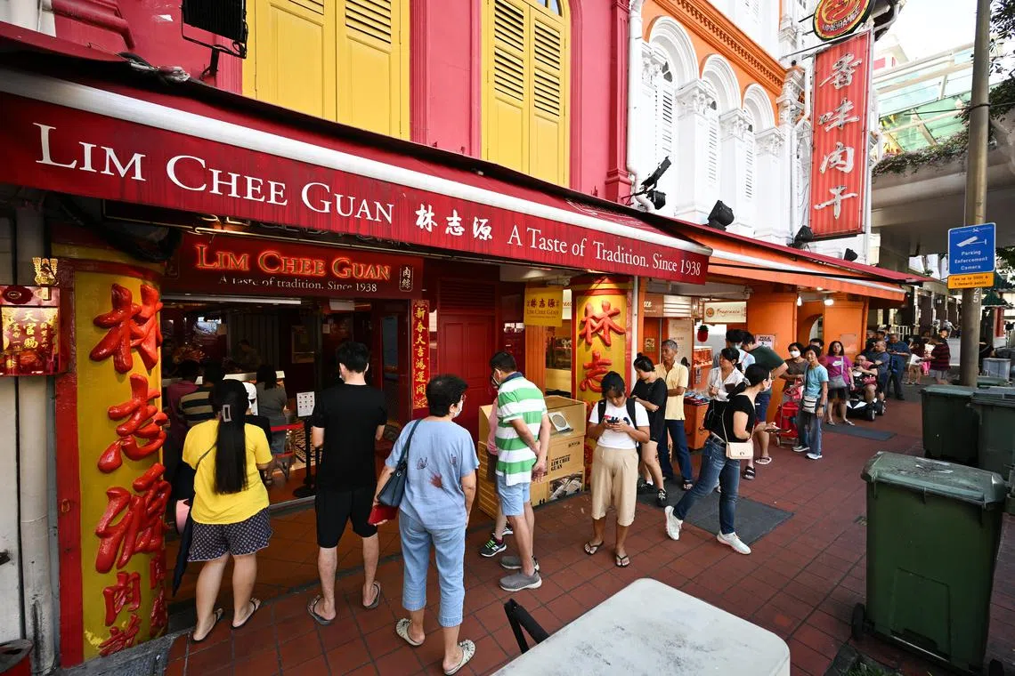 ST20240204-202401076187-Lim Yaohui-pixqueue/
Close to 40 customers queueing for bak kwa in front of Lim Chee Guan store at 9.06am when it opens at 9am at 203 New Bridge Rd in Chinatown on Feb 4, 2024.
Many people are rushing to get their hands on some bak kwa (barbecued sliced pork) with Chinese New Year falling on Feb 10, next Saturday.
Mr Alex Tiong, 52, Auditor, is in the queue and buying five to six kilograms of bak kwa at Lim Chee Guan store today. He has been coming to this store for almost six years. When asked what makes this store special from other bak kwa store, he says ‘I didn’t really know leh, I thught this is the most famous in Singapore’. He intends to keep half a kilogram for himself and give the rest to his friends, ‘I hardly eat it, I don’t really enjoy the bak kua. I buy it for friends, I thought this is the default thing for Chinese New Year. When I go overseas, my friends say this is the must try bak kua store in Singapore.’
This year, several bak kwa stores raised prices by about 10 per cent, and some had offerings that were priced at over $100 per kg, Shin Min Daily News reported on Jan 15.
At Lim Chee Guan, prices for its signature bak kwa rose from $78 last year to $80 per kg this year. Meanwhile, Fragrance was selling its signature sliced bak kwa at $66 per kg, up from $62 last year.
A spokesperson for Lim Chee Guan told Shin Min that the prices of bak kwa are higher this year mainly due to the increase in labour costs and raw material costs.
Despite these challenges, the spokesperson added that Lim Chee Guan will try its best to absorb costs and avoid further price increases.
(ST PHOTO: LIM YAOHUI)