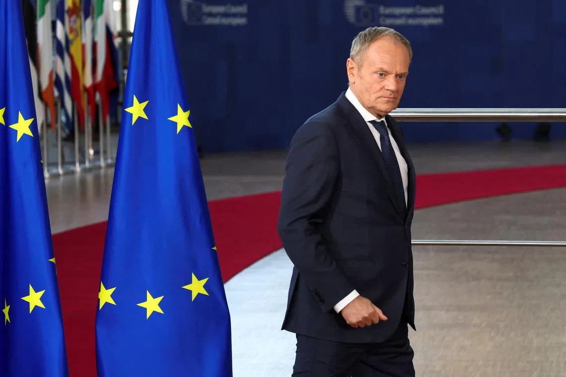 FILE PHOTO: Polish Prime Minister Donald Tusk walks on the day of a European Union leaders' summit in Brussels, Belgium March 19, 2026. REUTERS/Yves Herman/File Photo