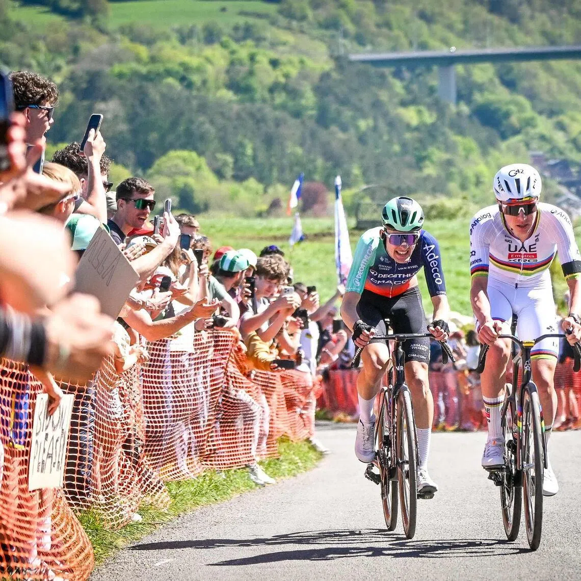 Decathlon CMA-CGM Team's French rider Paul Seixas (left) and UAE Team Emirates-XRG's Slovenian rider Tadej Pogacar in the men's elite race of the Liege-Bastogne-Liege UCI World Tour one-day cycling race on April 26, 2026.