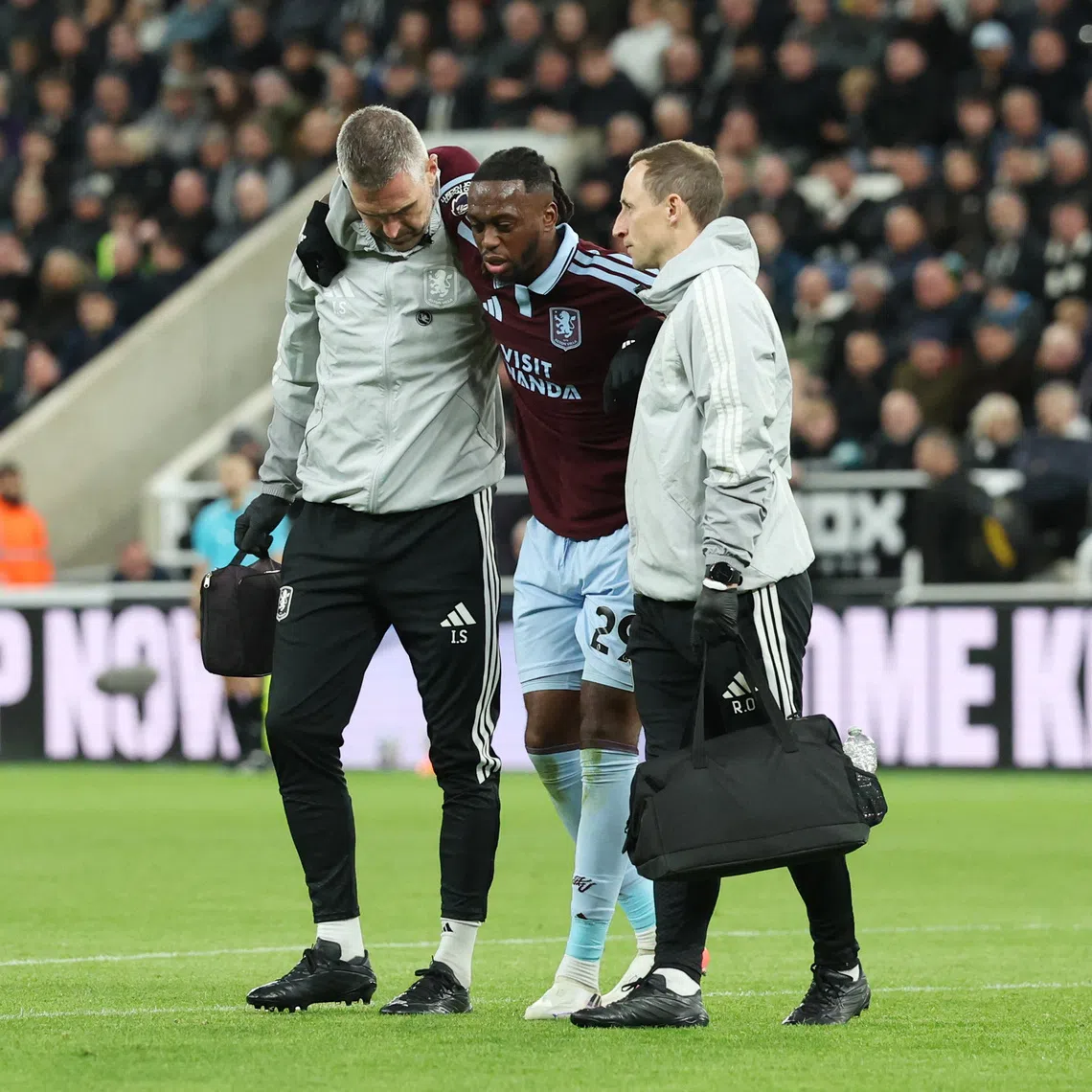 Soccer Football - Premier League - Newcastle United v Aston Villa - St James' Park, Newcastle, Britain - October 17, 2026 Aston Villa's Aaron Wan-Bissaka is helped off the pitch after sustaining an injury REUTERS/Scott Heppell/ File Photo