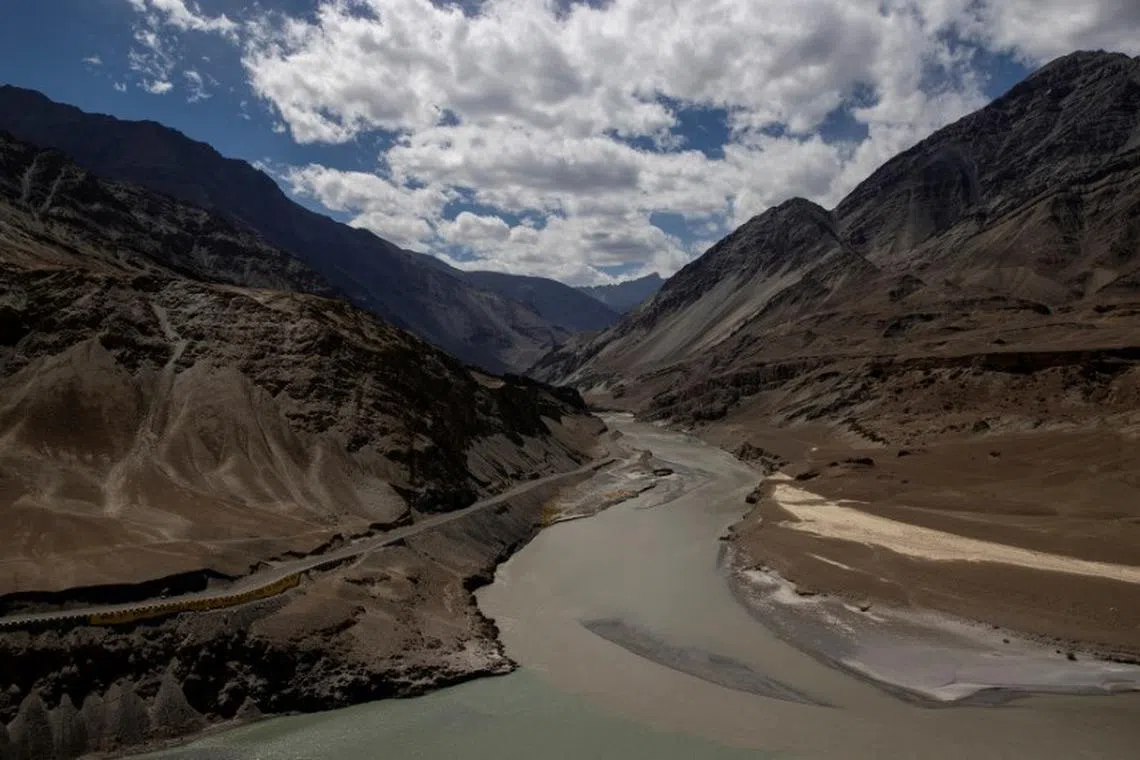 A highway being built by the Border Roads Organisation (BRO) passes by the confluence of the Indus and Zanskhar rivers in the Ladakh region, India, September 17, 2020. Picture taken September 17, 2020. REUTERS/Danish Siddiqui/file photo