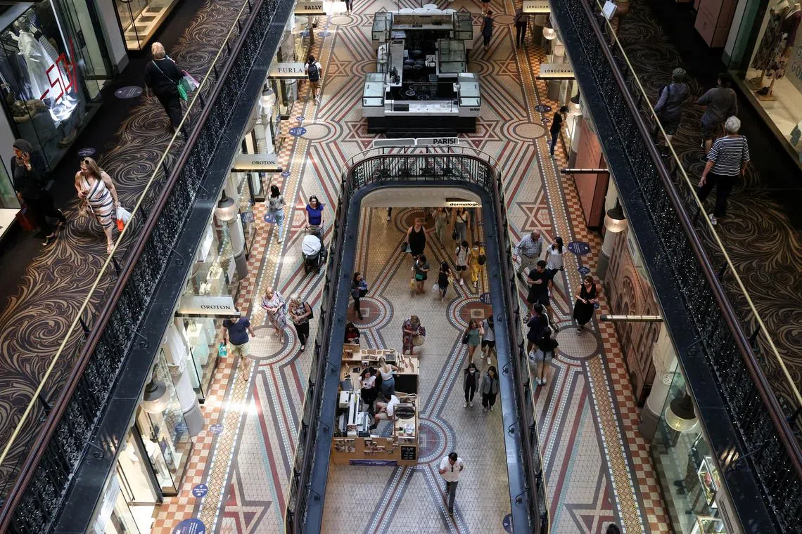 FILE PHOTO: Holiday shoppers are seen in a mall in the city centre of Sydney, Australia, December 17, 2020.  REUTERS/Loren Elliott/File Photo