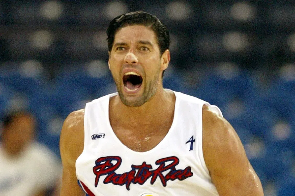 Puerto Rico's centre Jose Piculin Ortiz reacts after hitting the game-winning shot past Angola in double overtime during round two of the FIBA World Basketball Championship on September 4, 2002, in Indianapolis, Indiana, U.S. 