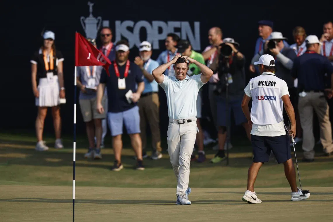 Rory McIlroy of Northern Ireland looking back at the pin after putting on the 18th green during the final round of the US Open.