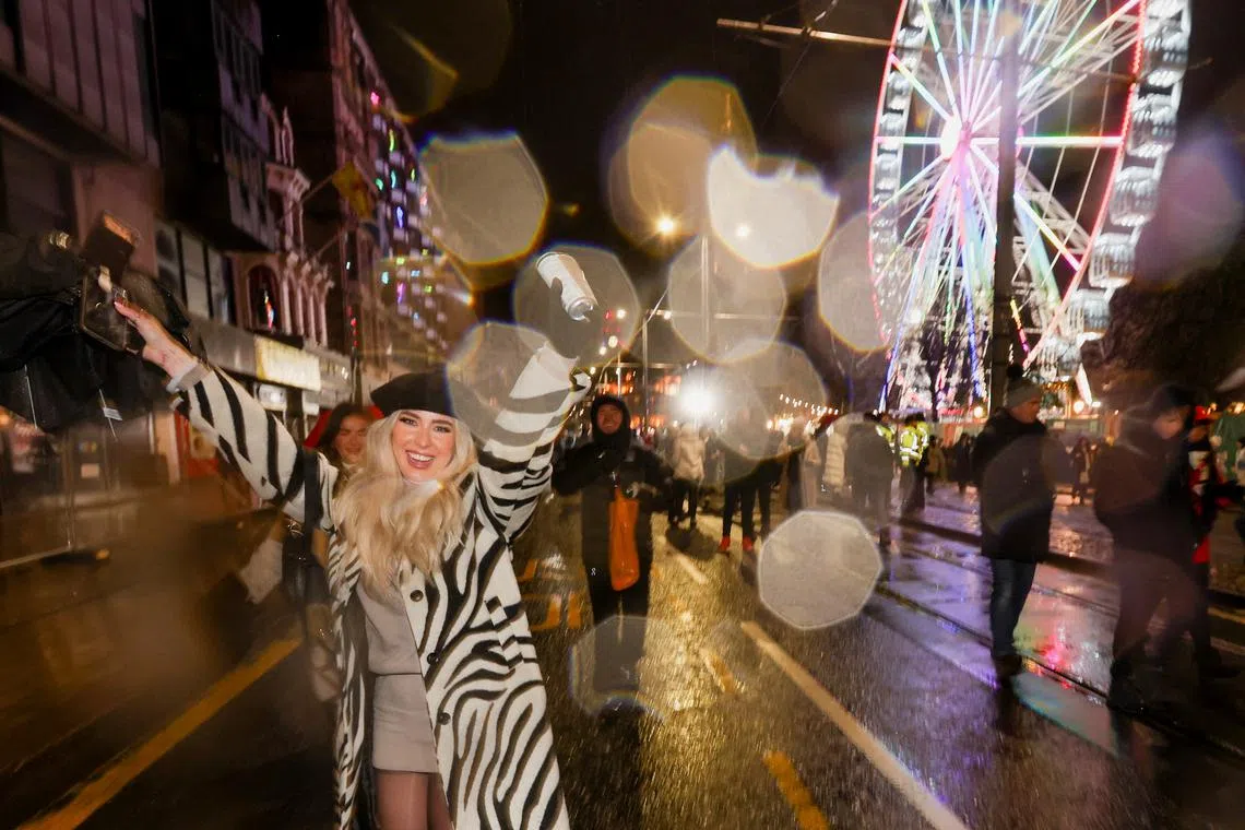 Revellers celebrate ahead of the New Year, in Edinburgh, Scotland, Britain Dec 31, 2022. 