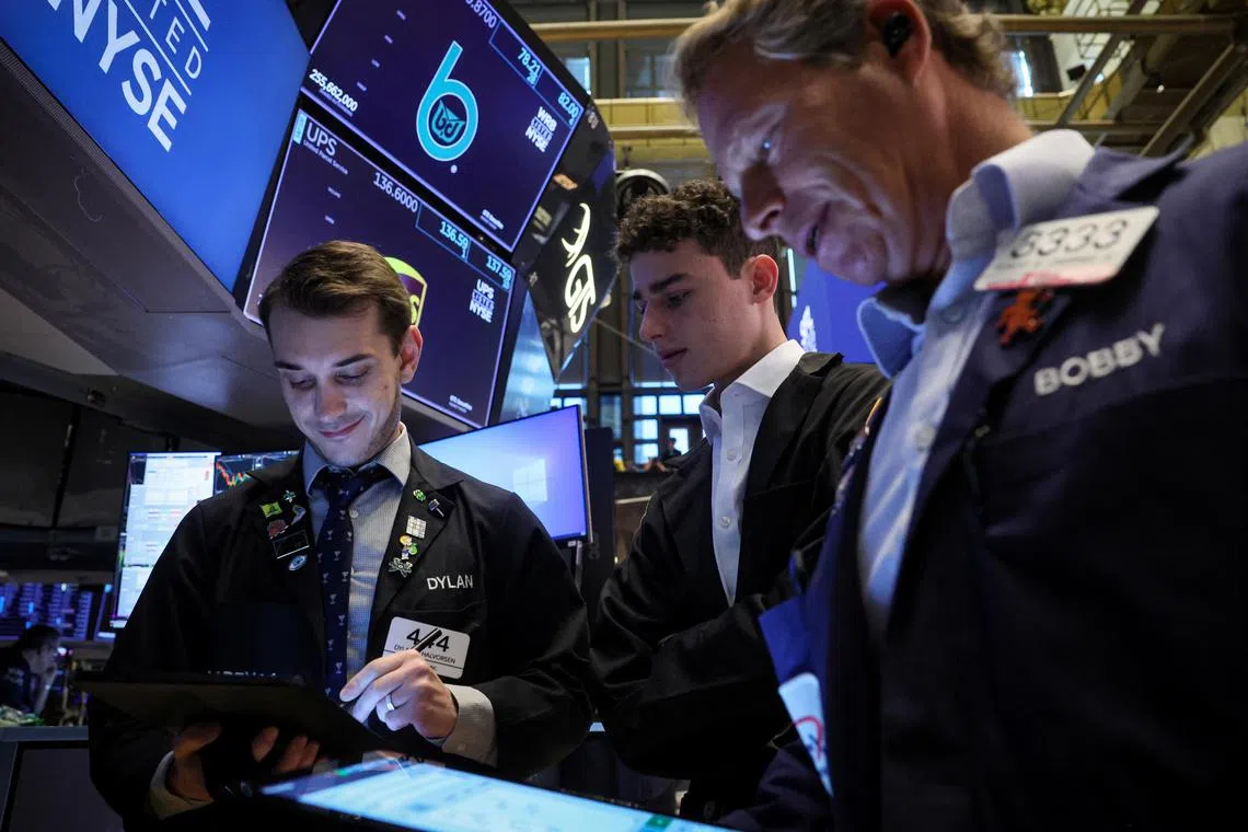 Traders work on the floor of the New York Stock Exchange, in New York City. 