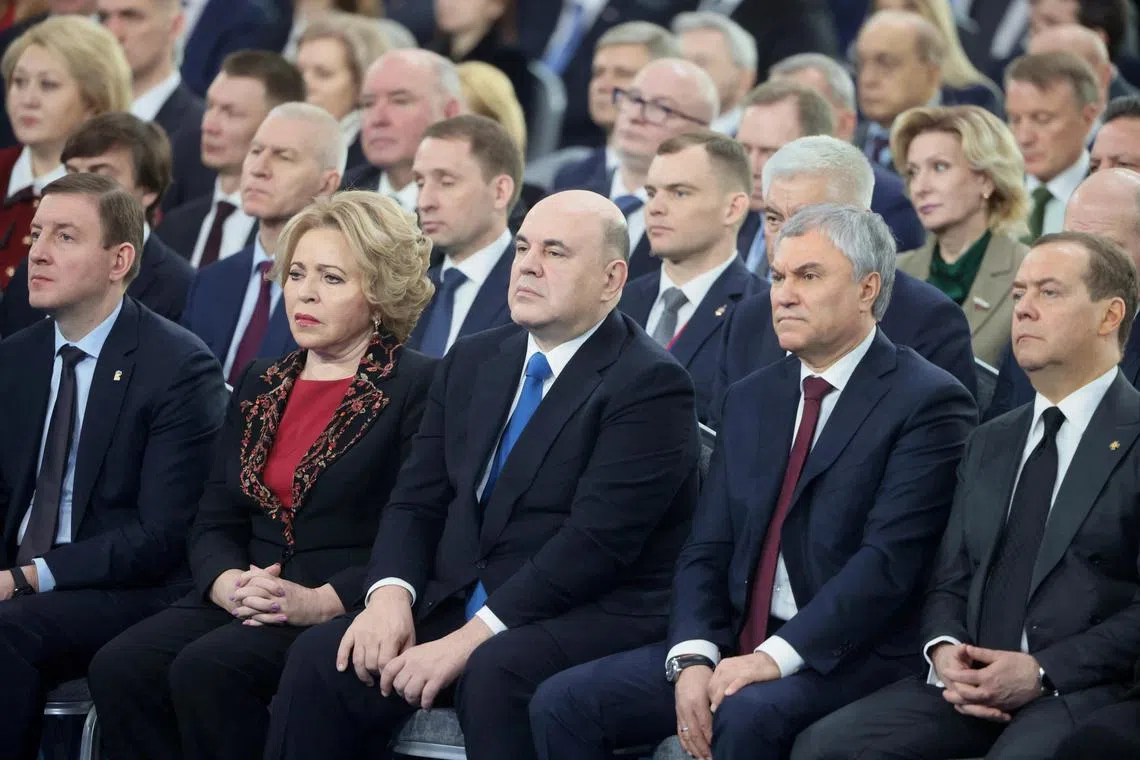 Russian Federation Council Deputy Chairman Andrei Turchak, Federation Council Speaker Valentina Matviyenko, Prime Minister Mikhail Mishustin, State Duma Speaker Vyacheslav Volodin and Security Council Deputy Chairman Dmitry Medvedev listen to Russian President Vladimir Putin's annual address to the Federal Assembly in Moscow, Russia February 21, 2023. Sputnik/Mikhail Metzel/Pool via REUTERS ATTENTION EDITORS - THIS IMAGE WAS PROVIDED BY A THIRD PARTY.