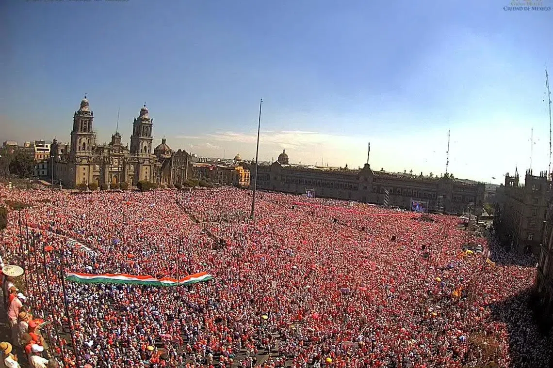 Demonstrators attending a protest in support of the National Electoral Institute (INE) and against President Andres Manuel Lopez Obrador's plan to reform the electoral authority, at Zocalo square in Mexico City, Mexico, Feb 26, 2023 in this still image taken from video.  