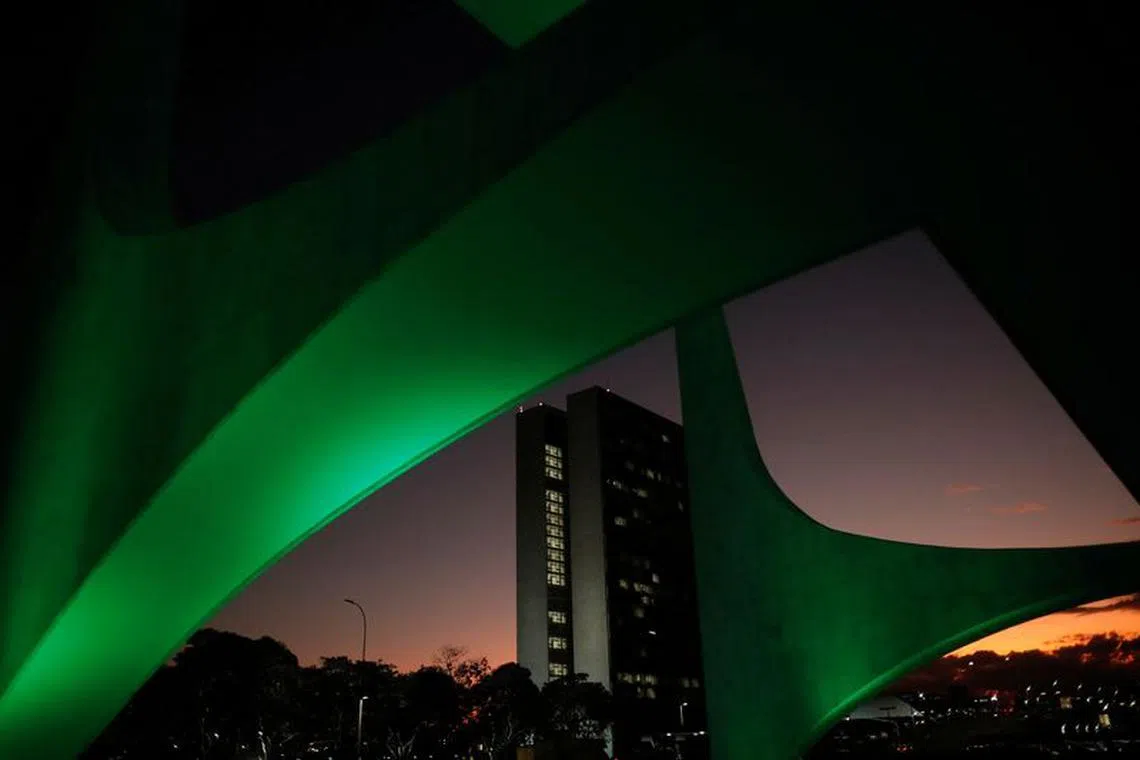 FILE PHOTO: The National Congress building is seen through architectural details of the Planalto Palace during sunrise in Brasilia, Brazil April 18, 2022. REUTERS/Adriano Machado/File Photo