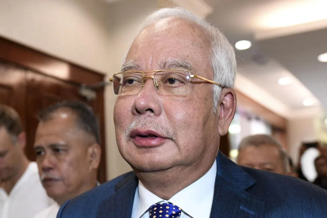 FILE PHOTO: Malaysia's former prime minister Najib Razak arriving in court for his 1MDB trial. 