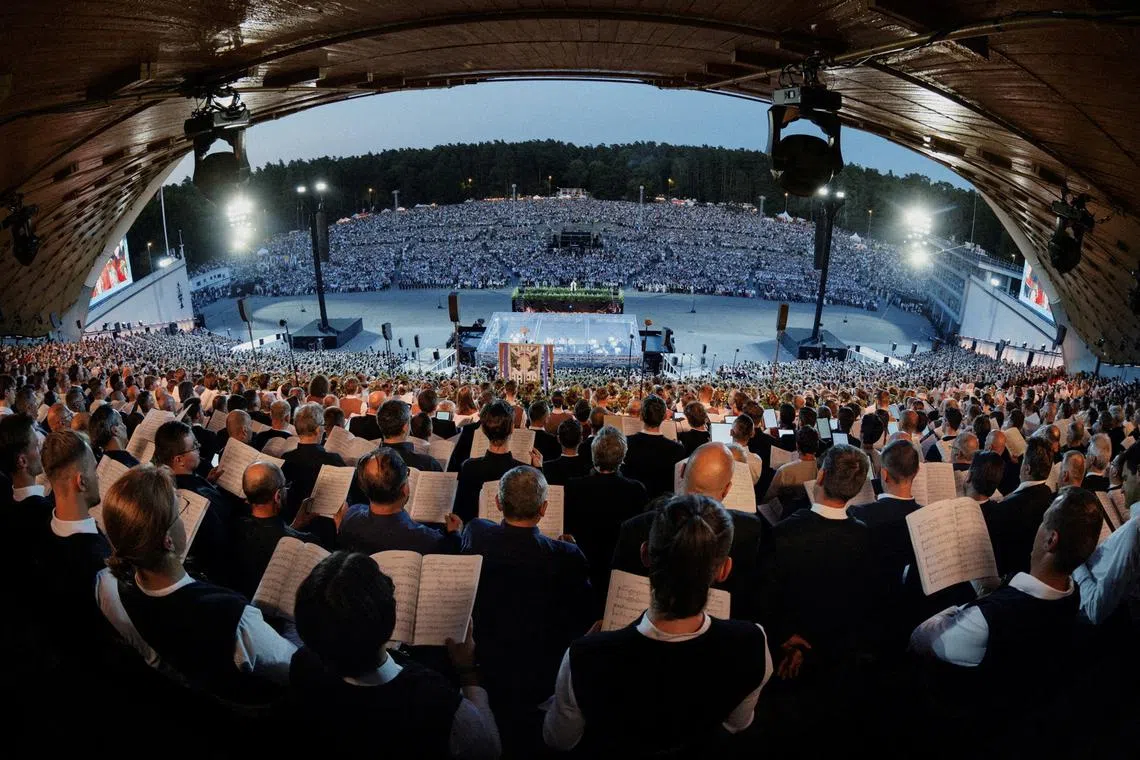 A view from the performers' tribune shows people singing the national anthem as part of a global celebration,in Vilnius, Lithuania, July 6, 2024. Gabrielius Jauniskis /Handout via REUTERS