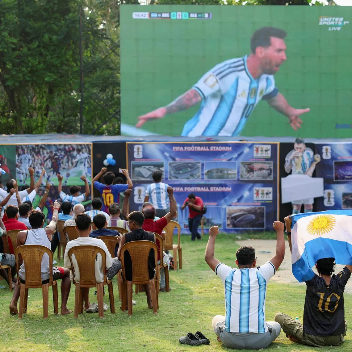 Fans watch the Group J match between Argentina and Algeria of the 2026 FIFA World Cup on a screen early morning in Kolkata, India, June 17, 2026. REUTERS/Sahiba Chawdhary